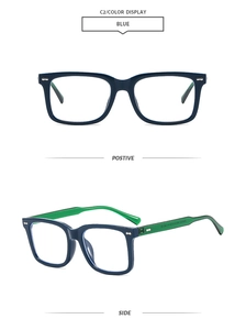Detail view of square glasses frames in blue and green color block with metal studs
