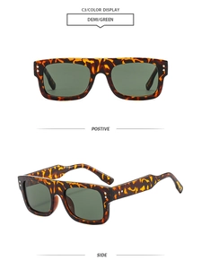 Detail of demi tortoise square sunglasses with green lenses and silver rivet accents