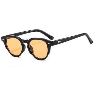 Vintage round frame sunglasses with thick black frames and translucent orange lenses