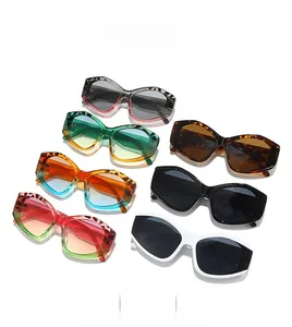 A vibrant assortment of oversized retro sunglasses in leopard, green, and orange frames