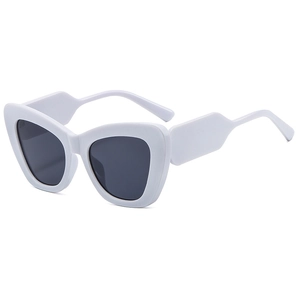 Women's cat eye sunglasses with ivory white frames and dark grey lenses for street style