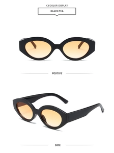 Detail view of stylish retro cat-eye sunglasses with black frame and tea lenses