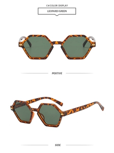 Detail view of leopard print polygon sunglasses with green lenses and metal accents