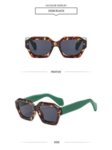 Detail view of stylish tortoiseshell polygon sunglasses with vibrant green contrast temples
