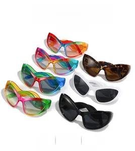Multiple cat eye sunglasses in rainbow, leopard, and solid colors stacked on white background