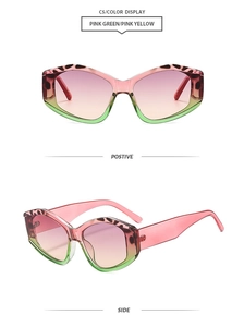 Detail view of cat-eye sunglasses with pink green gradient frame and spotted texture