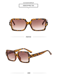 Detailansicht der quadratischen Leoparden-Sonnenbrille mit braunen Verlaufsgläsern und Metallscharnier