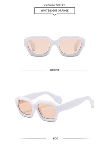 Detail view of white irregular geometric sunglasses with light orange lenses