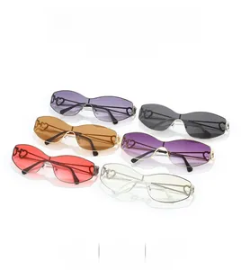 Flat lay of trendy rimless heart-shaped sunglasses in vibrant multiple color options