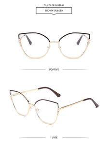 Detail of brown and golden cat-eye frames featuring elegant pearl and diamond accents