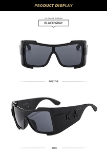 Front and side views of black oversized frame sunglasses with wide temples and round trim