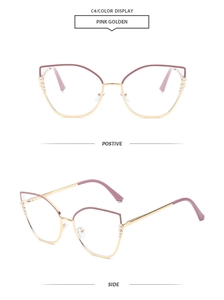 Detail of pink golden cat-eye glasses frame with pearl accents and metal temples