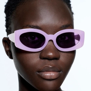 Lunettes de soleil ovales tendance lilas avec branches blanches de style Y2K chic