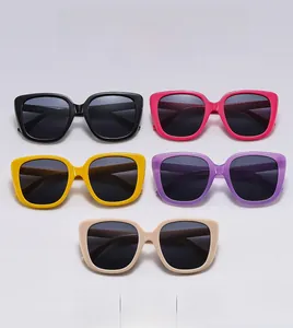 Fashionable oversized square Y2K sunglasses in various candy colors shown in a flat lay view