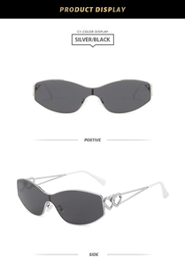 Detail view of silver metal sunglasses with creative double heart cutouts on temples