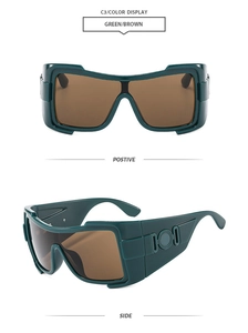 Detail view of oversized green frame sunglasses with metal relief on the wide temples