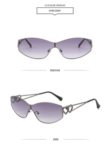 Detail view of gunmetal sunglasses with purple gradient lenses and double heart temple