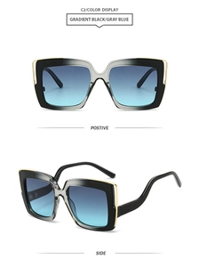 Detail view of square oversized sunglasses with gold metal hinges and gradient blue lenses