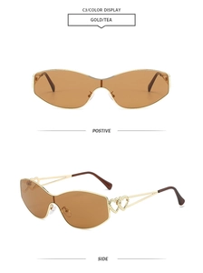 Detail of Gold and Tea cat-eye sunglasses with double heart hollow metal temples
