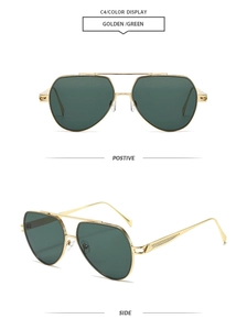 Close-up of golden aviator sunglasses with green lenses and double bridge design
