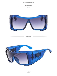 Detail of oversized blue shield sunglasses with wide temples and grey gradient lenses