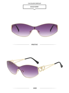 Detail of gold metal frame with hollow double heart design on purple gradient sunglasses