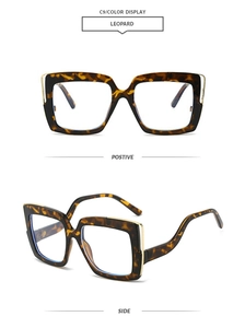 Detail view of leopard print oversized square glasses with gold temple accents