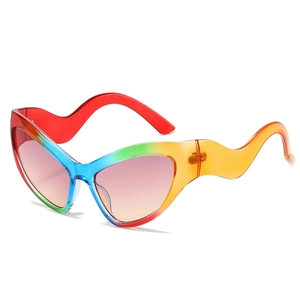 Cat eye sunglasses with rainbow gradient frames and unique wavy temples in a trendy style