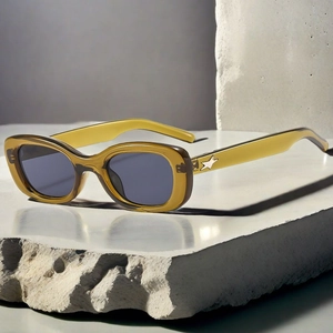 Detail of vintage oval sunglasses with green translucent frame and silver star metal hinge