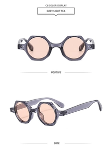 Detail view of grey polygonal retro sunglasses with light tea resin lenses and metal studs
