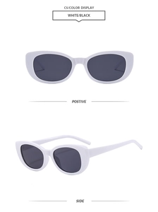 Front and side views of vintage cat eye sunglasses with white frames and dark lenses