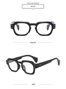 Detail view of black thick-frame geometric glasses with metallic side dots