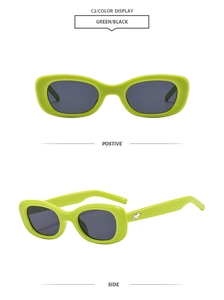 Detail view of oval green sunglasses with star metal decor and dark lenses