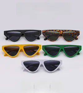 Five assorted vintage triangle cat-eye sunglasses in black, tortoiseshell, yellow and green
