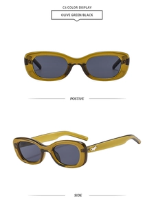 Detail of olive green oval sunglasses featuring silver star ornaments and black lenses