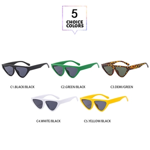 Close-up of triangle cat eye sunglasses in black, green, white, yellow, and tortoiseshell