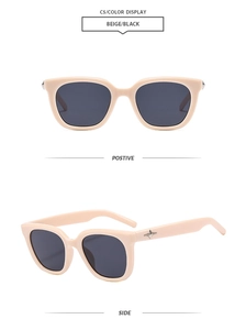 Detail view of beige square frame sunglasses with silver star ornament and dark lenses