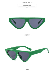 Detail view of green cat-eye sunglasses featuring wide temples and dark gray lenses