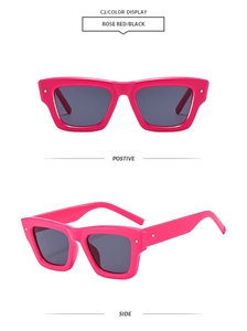 Detail view of rose red square sunglasses with silver rivets and dark grey lenses