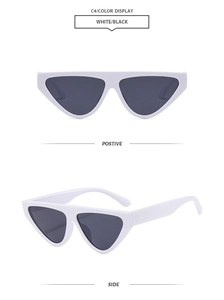 Detail view of white triangular cat-eye sunglasses with dark lenses and sturdy hinges