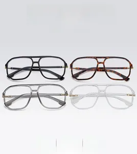 Détail de quatre montures de lunettes polygones à double pont en diverses couleurs