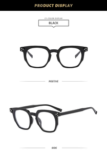 Macro detail of black polygon glasses frames featuring silver rivet metal accents