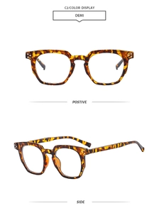 Detail view of tortoiseshell polygon eyeglass frames showing front and side profile views