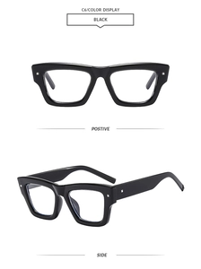 Detail of black thick frame square glasses with silver stud accents and glossy finish