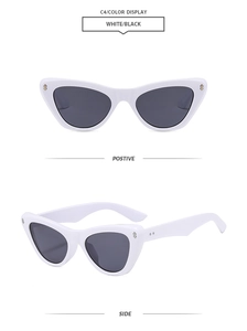 Detail of white cat eye sunglasses with metal rivets and dark lenses from two angles