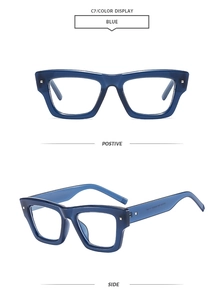 Detail of blue thick-frame square sunglasses with decorative silver metal rivets on side