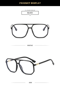 Vues de face et de côté de lunettes aviateur noires à double pont et charnières dorées
