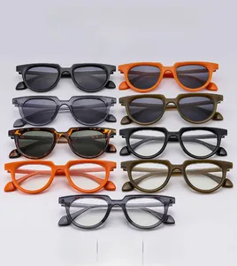 Close-up of retro oval frame sunglasses in multiple colors and thick temple details