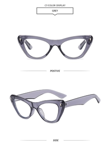 Detail of grey cat-eye frames with metal rivets and transparent resin finish