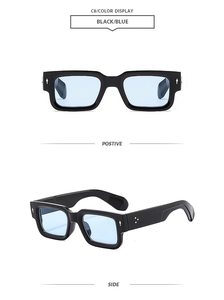Detail of square vintage sunglasses with black frame, blue lenses and metal rivets